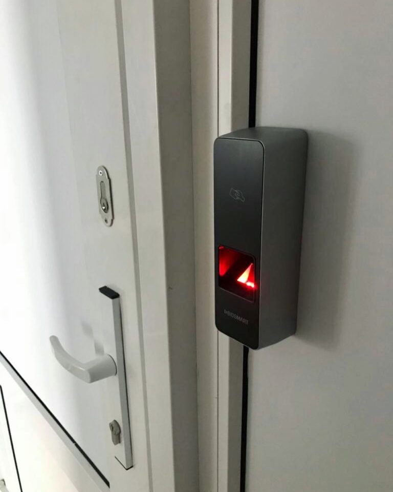 Wall-mounted credential reader at an office entrance