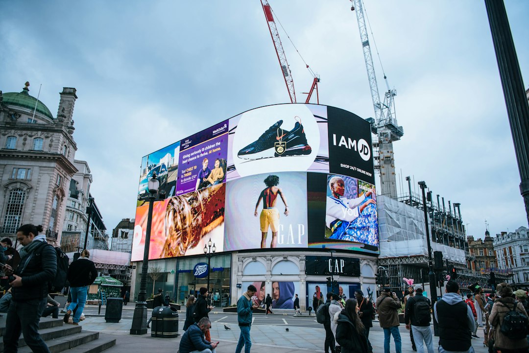 Outdoor advertising displays and pedestrians, illustrating the need to plan content for viewing distance